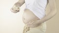 Pregnant woman belly with the week number 18 Royalty Free Stock Photo