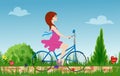 Pregnant young woman riding bike on spring flowering field. Royalty Free Stock Photo