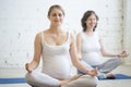 Pregnant young women doing prenatal yoga. Meditation Royalty Free Stock Photo