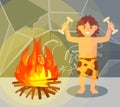 Prehistoric boy in animal skin standing near bonfire in stone cave, Stone Age character vector Illustration
