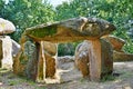 Prehistoric dolmen near megalithic menhirs alignment. Carnac, Brittany. France Royalty Free Stock Photo