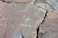 Prehistoric petroglyphs on a granite plate in the North Karelia Royalty Free Stock Photo