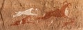 Prehistoric Petroglyphs in libian sahara desert Royalty Free Stock Photo