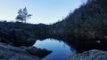 Tjodnane lake at sunrise on the Preikestolen trail in Norway in autumn