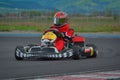 PREJMER, BRASOV, ROMANIA - MAY 3: Unknown pilots competing in National Karting Championship Dunlop 2015, on May 3, 2015 Royalty Free Stock Photo