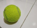 Preloved tennis ball on the floor