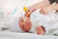 Premature born infant with thermometer in hospital Royalty Free Stock Photo