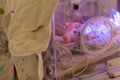 The premature little baby in an incubator at the neonatal section of the maternity