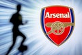 LONDON, ENGLAND, JULY. 1. 2019: Arsenal Football club logo, Premier League, England. Soccer player silhouette Royalty Free Stock Photo