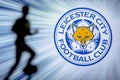 LONDON, ENGLAND, JULY. 1. 2019: Leicester City Football club logo, Premier League, England. Soccer player silhouette Royalty Free Stock Photo