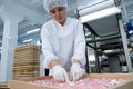 Shymkent, Kazakhstan - 03.12.2020 : Rakhat confectionery factory. Employees are engaged in packaging marmalade candies