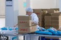 Shymkent, Kazakhstan - 03.12.2020 : Rakhat confectionery factory. Employees pack candy in branded boxes Royalty Free Stock Photo