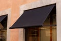 Premium black awning, outside a shop or restaurant, presenting an excellent space