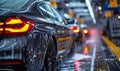 Premium black sedan car undergoing a deep clean with high-foam soap at a car wash station, showcasing a meticulous auto detailing Royalty Free Stock Photo