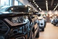 Premium black SUVs in modern dealership showroom with huge windows