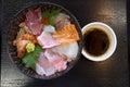 Premium fresh raw seafood mixed rice bowl Kaisen-don/ Japanese tasty food, Japanese Rice with sashimi of tuna, Maguro, Otoro, Royalty Free Stock Photo