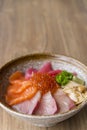 Premium fresh raw seafood mixed rice bowl Kaisen-don, Japanese tasty food, Japanese Rice with sashimi of tuna, Maguro, Otoro, Royalty Free Stock Photo