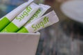 Premium granulated sugar from sugar cane for sweetening is served at the table of a cafe in a tourism area