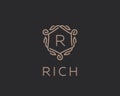 Premium linear shield monogram letter R logotype. Elegant crest leaf stamp icon vector logo. Luxury alphabet frame