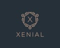 Premium linear shield monogram letter X logotype. Elegant crest leaf stamp icon vector logo. Luxury alphabet frame