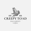 Premium Quality Halloween Logo or Label Template. Hand Drawn Creepy Toad or Frog Sketch Symbol and Retro Typography.