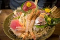 Premium sashimi, mix raw seafood on bowl at Japanese restaurant.