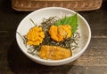 Premium supreme delicious fresh from the sea 3 types of uni sea urchin sashimi from Tokyo, Mexico, Canada on top of warm steamed