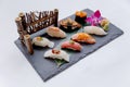 Premium Sushi Set Include Engawa, Hamachi, Hotate, Toro, Foie Gras, Salmon, Sea Urchin and Tai. Royalty Free Stock Photo