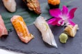 Premium Sushi Set Include Engawa, Hamachi, Hotate, Toro, Foie Gras, Salmon, Sea Urchin and Tai. Royalty Free Stock Photo