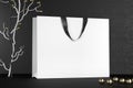 Premium white shopping bags mock-up, package for purchases on a black background. White paper shopping bag with black Royalty Free Stock Photo