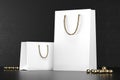 Premium white shopping bags mock-up, package for purchases on a black background. White paper shopping bag with golden Royalty Free Stock Photo