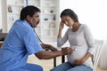 Prenatal Care. Obstetrician Doctor Doing Checkup To Sick Pregnant Woman In Clinic