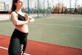 Prenatal exercises. Prenatal healthy fitness active fit gym outside. Pregnant woman training yoga sport exercise