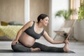 Prenatal Gymnastics. Happy Young Pregnant Woman Stretching On Yoga Mat At Home Royalty Free Stock Photo