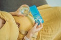 Prenatal Vitamins. Portrait Of Beautiful Smiling Pregnant Woman Holding Pill Box and a glass of water, Taking Royalty Free Stock Photo