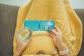 Prenatal Vitamins. Portrait Of Beautiful Smiling Pregnant Woman Holding Pill Box and a glass of water, Taking Royalty Free Stock Photo