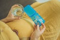 Prenatal Vitamins. Portrait Of Beautiful Smiling Pregnant Woman Holding Pill Box and a glass of water, Taking Royalty Free Stock Photo