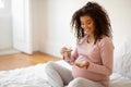 Prenatal Vitamins. Smiling Black Pregnant Woman Holding Pills And Glass Of Water, Royalty Free Stock Photo