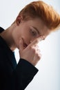 Preoccupied red-haired young man thinking Royalty Free Stock Photo