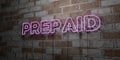 PREPAID - Glowing Neon Sign on stonework wall - 3D rendered royalty free stock illustration