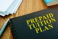 Prepaid Tuition Plan and papers with pan. Loan for education.