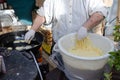 Preparacion deep fried fritters donuts in market