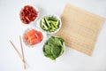 Preparation of all ingredients for cooking sushi seafood, vegetables, rice, nori, sticks, rug Royalty Free Stock Photo