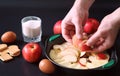 Preparation of apple pie at home. Homemade pastries with apples and nuts. Sweet dessert from apples baked Royalty Free Stock Photo