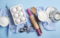 Preparation for baking. Ingredients and kitchen items for baking. Kitchen utensils, flour, eggs, sugar.