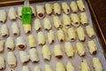 Preparation for baking sausage in puff pastry on a cutting board