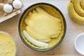 Preparation banana cake cheesecake making from ingredients on wooden table background. Flat lay. Top view