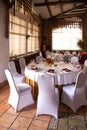 Banquet round tables decorated with a bouquet in the center of the tables