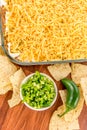 Preparation of bean dip with jalapenos, sour cream and cheddar c