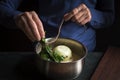 Preparation of bechamel sauce, bouquet of garnishes in hands